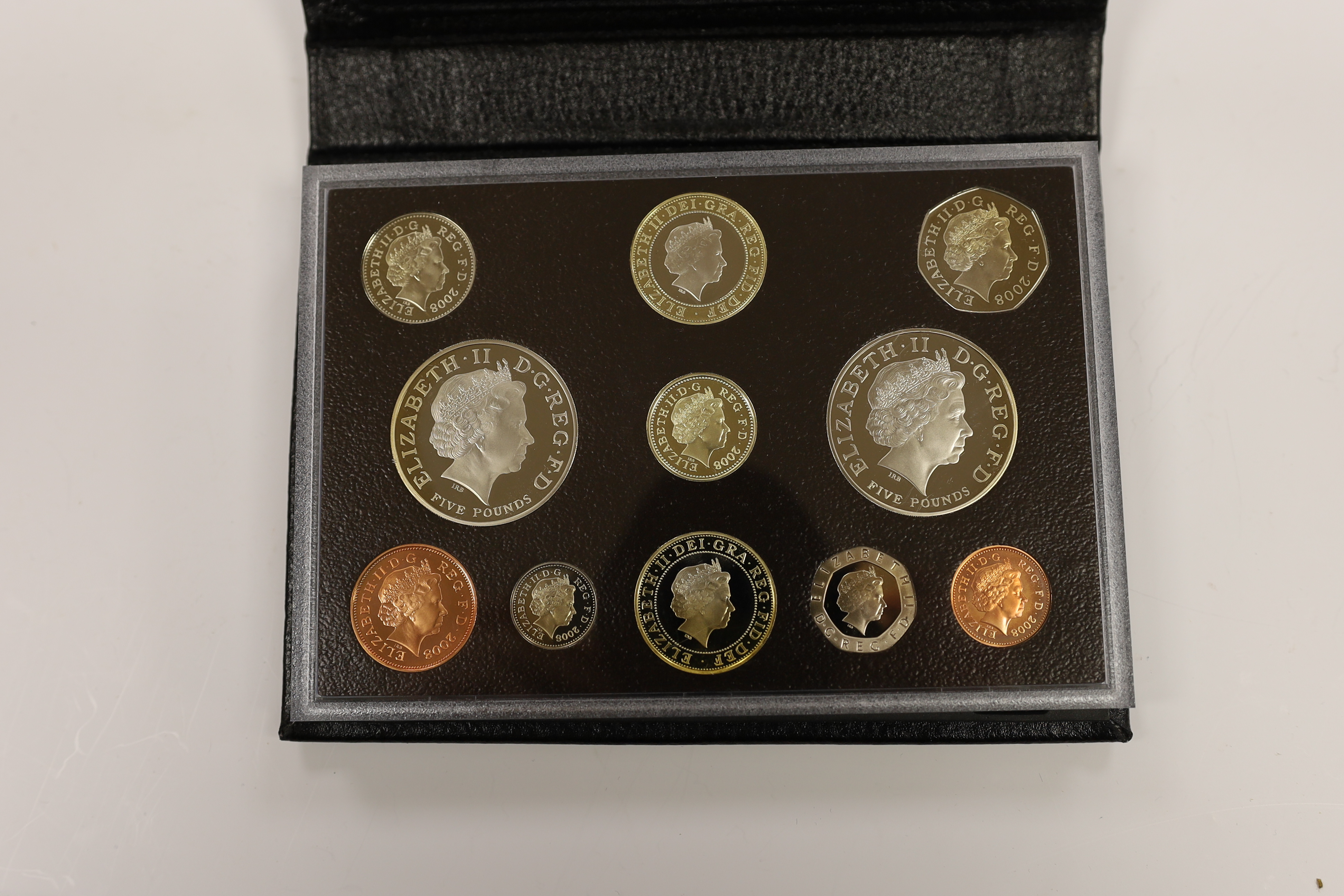 Royal Mint UK QEII proof coin year sets for 2002, 2003, 2005-2008, 2010, 2012 together with two Executive Collections for 2001 & 2004 and a Royal Shield Arms collection 2008, 11 cases